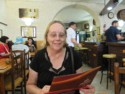 June reads the menu at the Copacabana